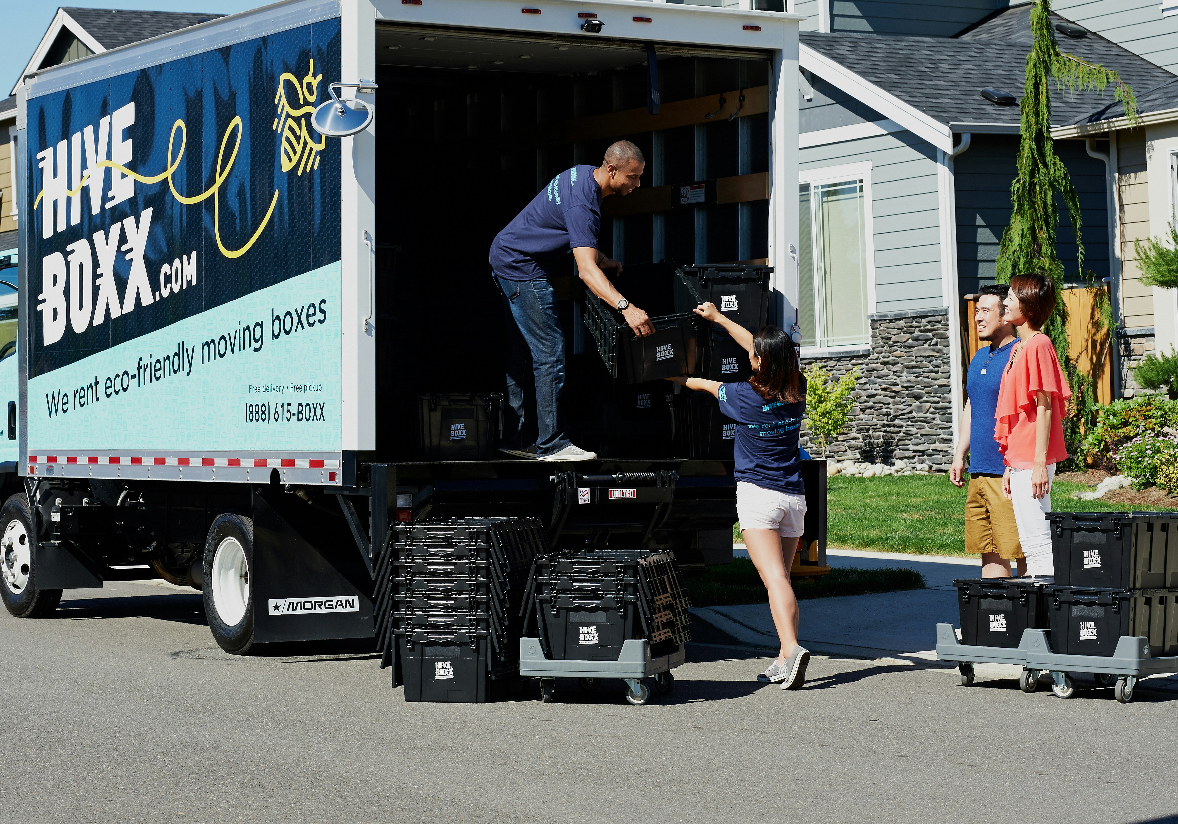Movers loading boxes into a truck