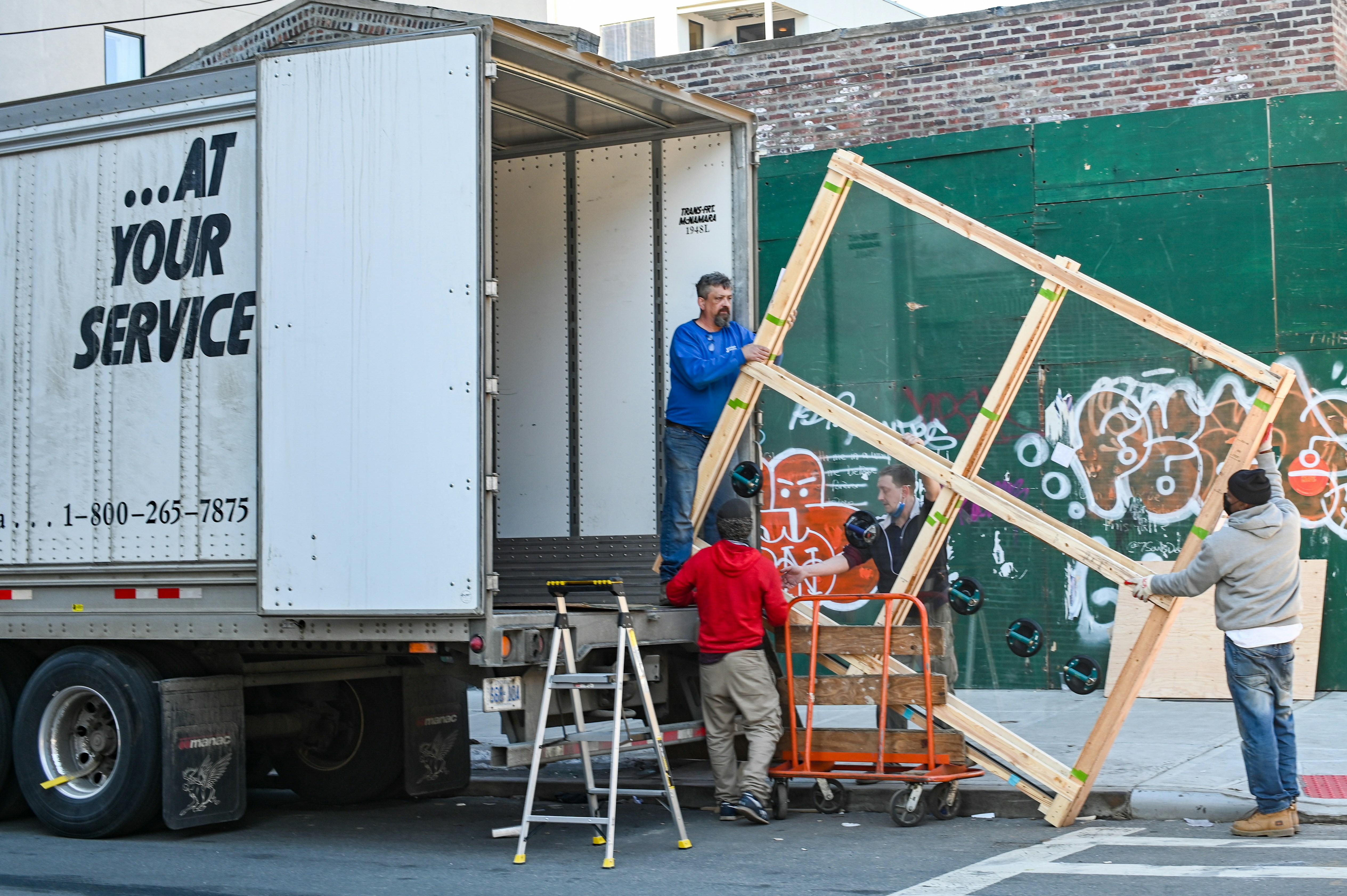 Professional movers loading a truck